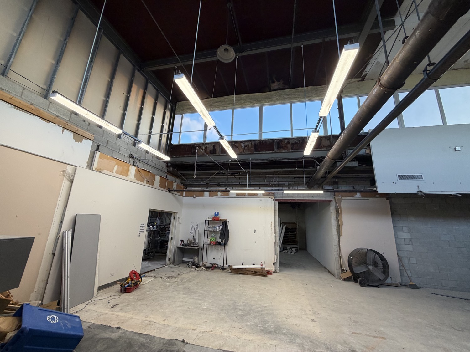 Hanging shop lights in a warehouse